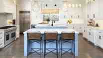 Full kitchen interior design by ML Interiors Group, focusing on kitchen island lighting