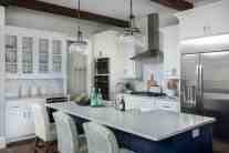 Glass kitchen cabinets interior design by ML Interiors Group in Dallas, TX