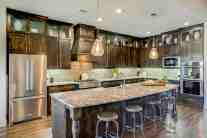 Glass kitchen cabinets interior design by ML Interiors Group in Dallas, TX