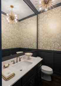 Powder bathroom design using mixed metal hardware by ML Interiors Group in Dallas, TX