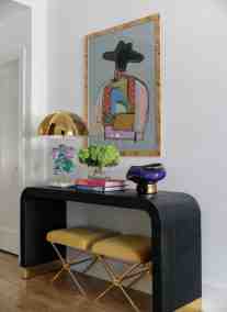Start small. Orange elements in the artwork is a subtle way to introduce orange into your home’s color palette.