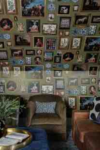 Brown velvet swivel chairs and a chestnut leather sofa are the grounding brown shades in this lively game room, giving the color of the wallcoverings and accent fabrics a resting spot that doesn’t make it feel saturated and overdone.