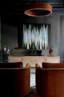 A deep, rich color palette in the study provides the perfect backdrop for a successful day at the office.