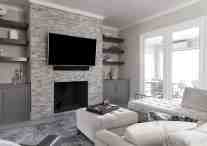 Living room with fireplace designed by ML Interiors Group in Dallas, TX